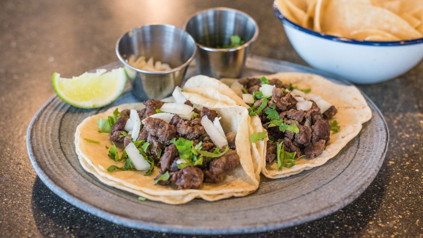 Plate of tacos with fresh toppings